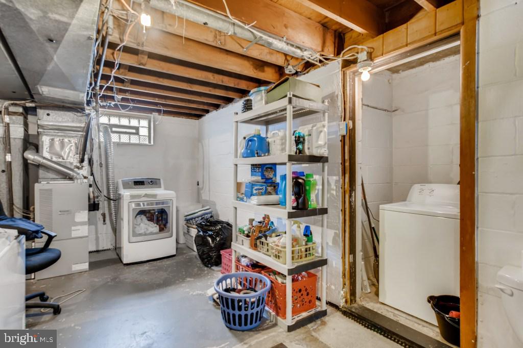 3714 Campfield Road Baltimore, MD 21207 - Photo 27 of 32 a storage room with washer and dryer