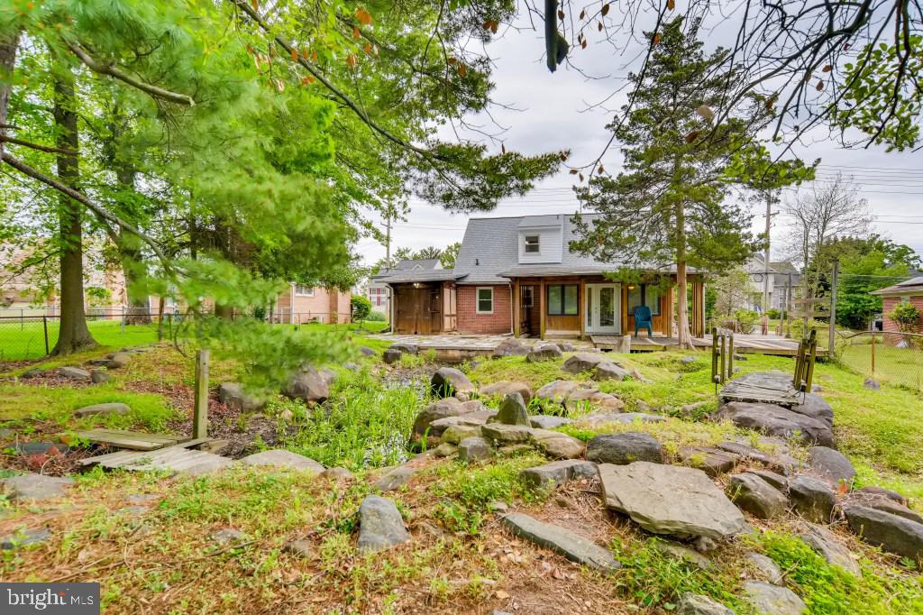 3714 Campfield Road Baltimore, MD 21207 - Photo 29 of 32 a front view of a house with garden