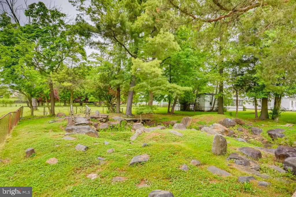 3714 Campfield Road Baltimore, MD 21207 - Photo 32 of 32 a backyard of a house with trees and outdoor seating