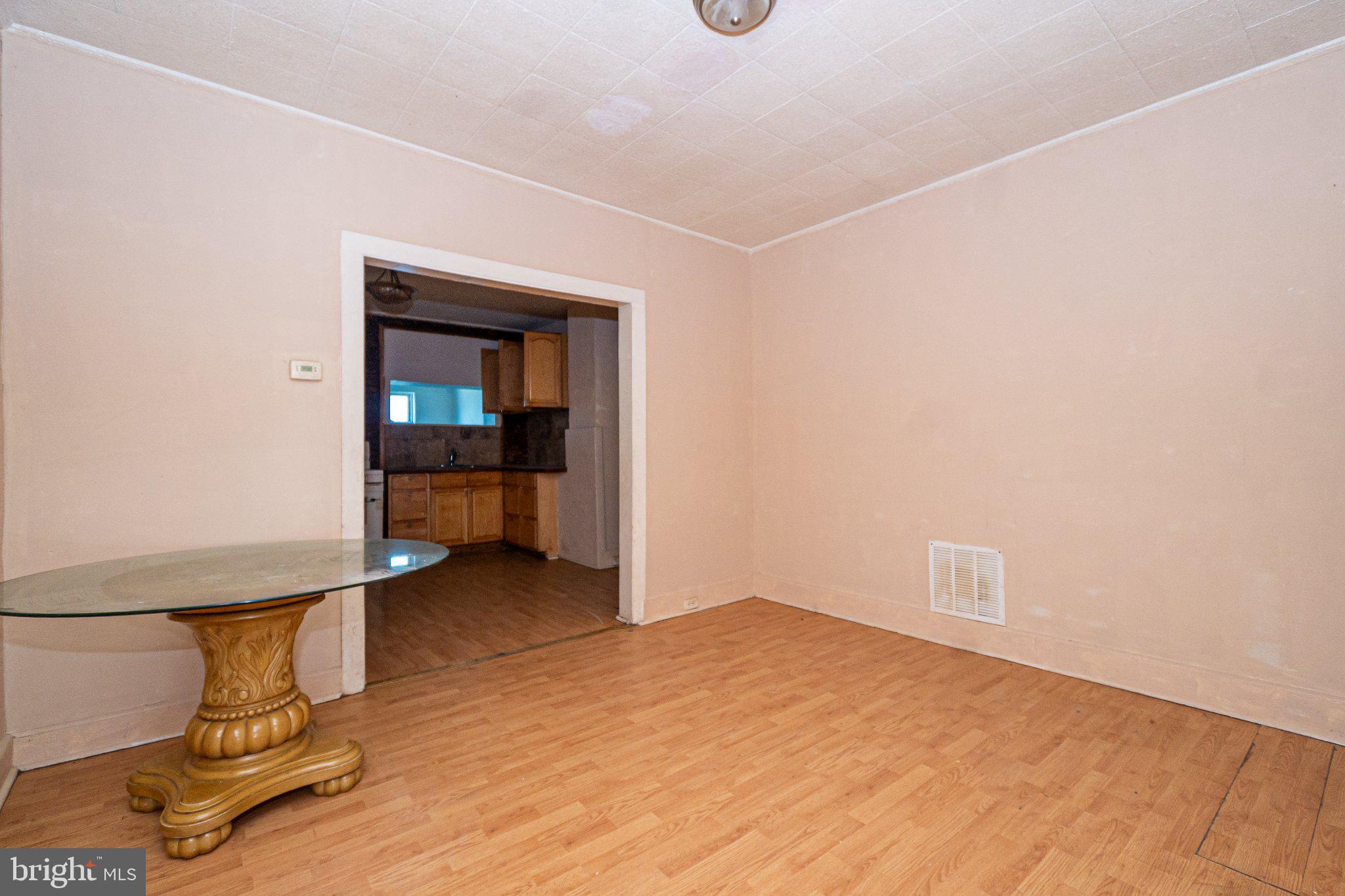 423 Furrow Street Baltimore, MD 21223 - Photo 13 of 24 a view of a room with wooden floor