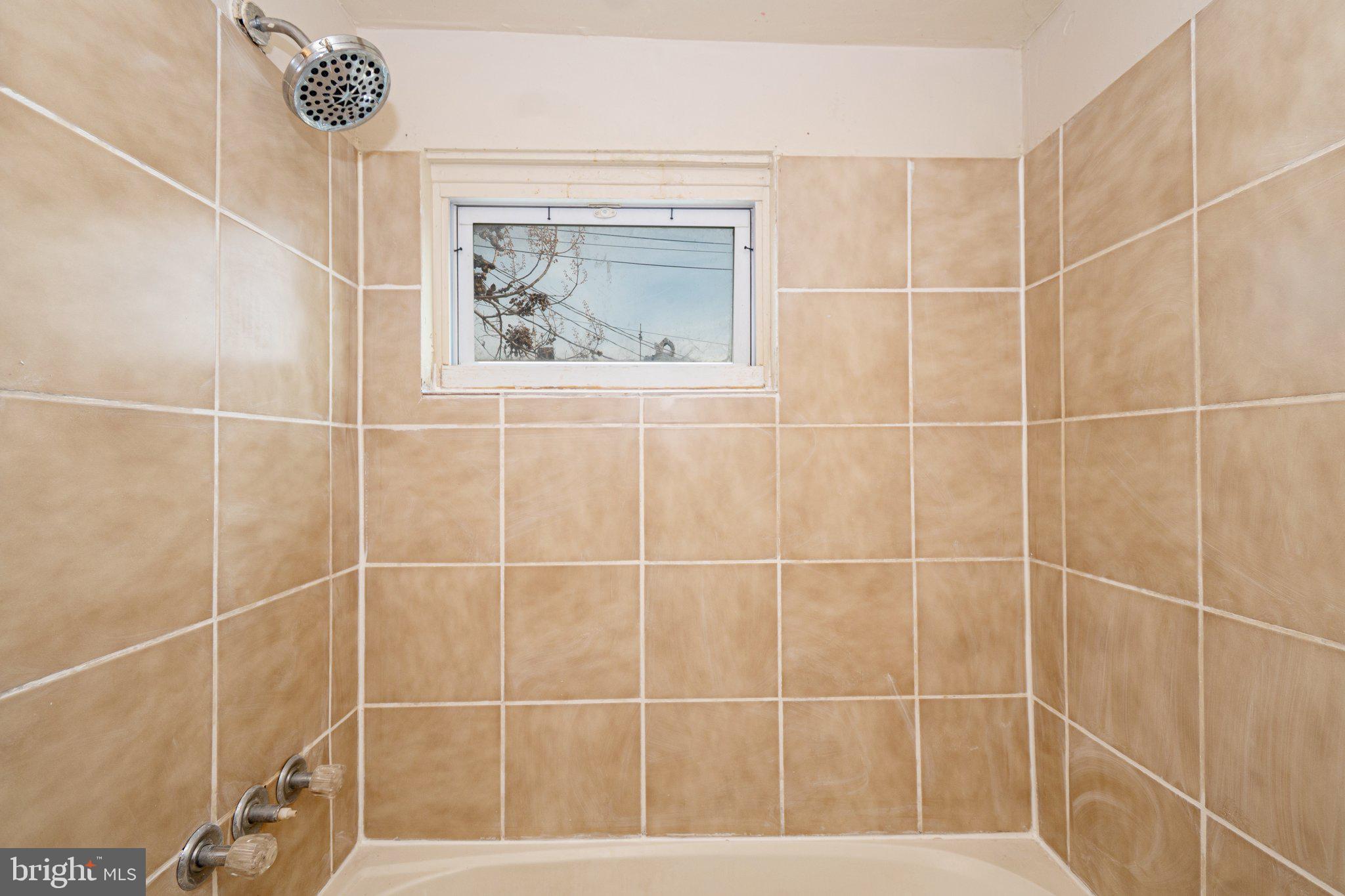 423 Furrow Street Baltimore, MD 21223 - Photo 15 of 24 a bathroom with a shower
