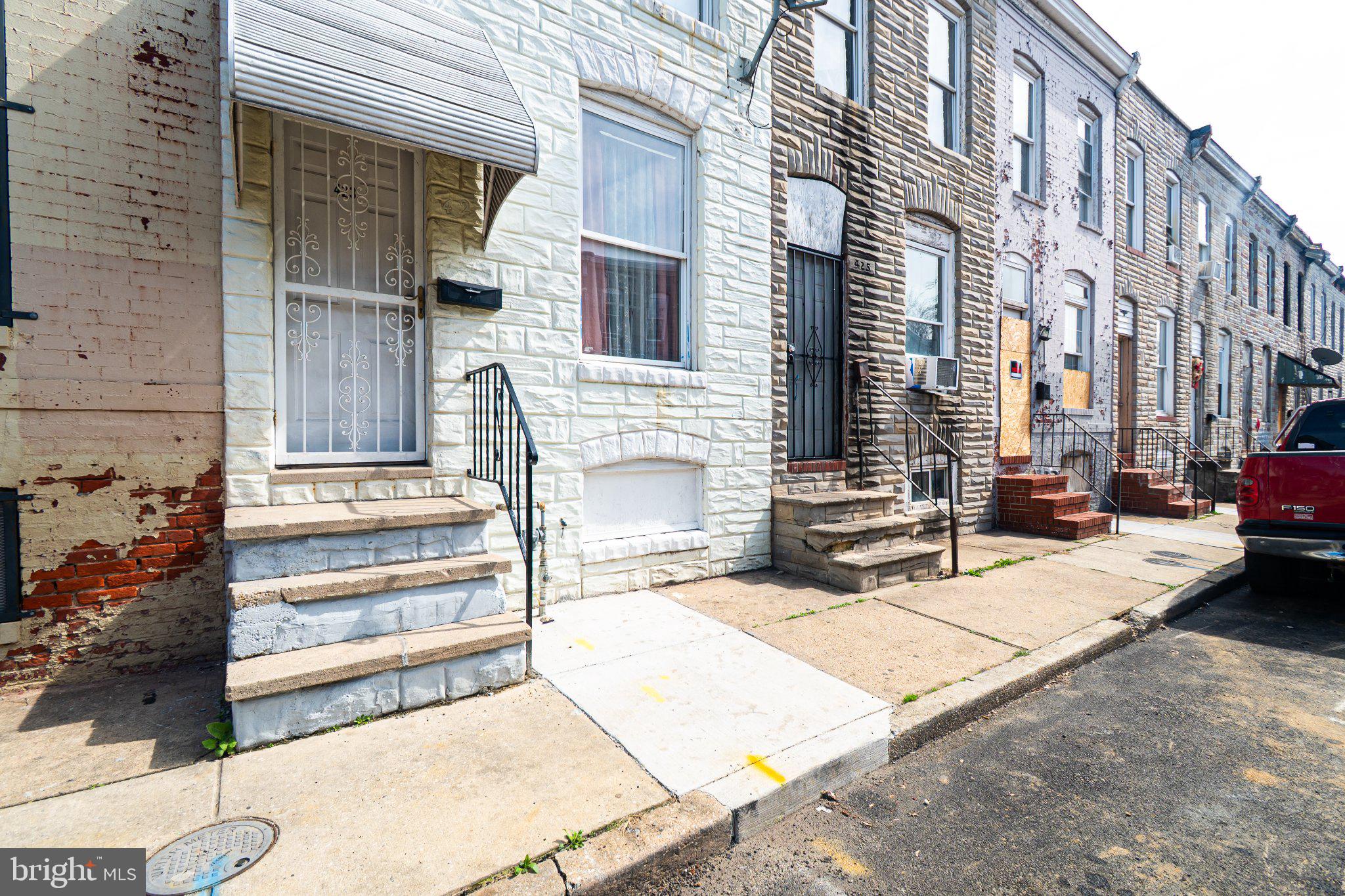 423 Furrow Street Baltimore, MD 21223 - Photo 2 of 24 a view of a building with many windows