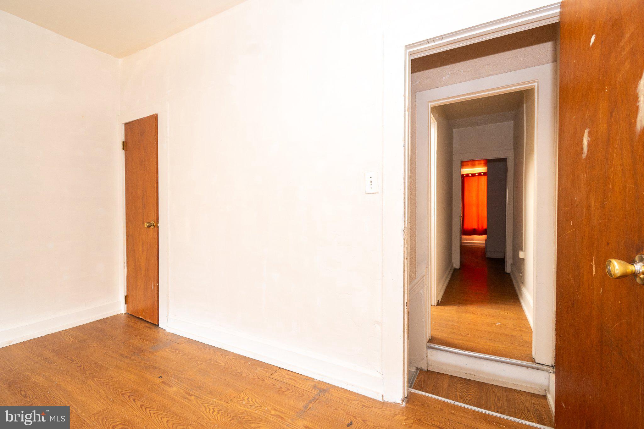 423 Furrow Street Baltimore, MD 21223 - Photo 22 of 24 a view of a hallway with wooden floor