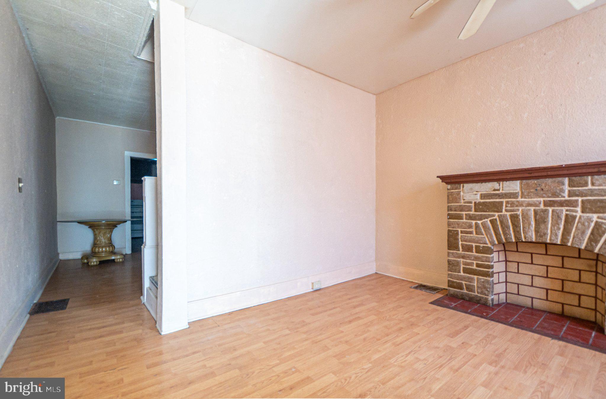 423 Furrow Street Baltimore, MD 21223 - Photo 4 of 24 a view of livingroom with furniture and closet
