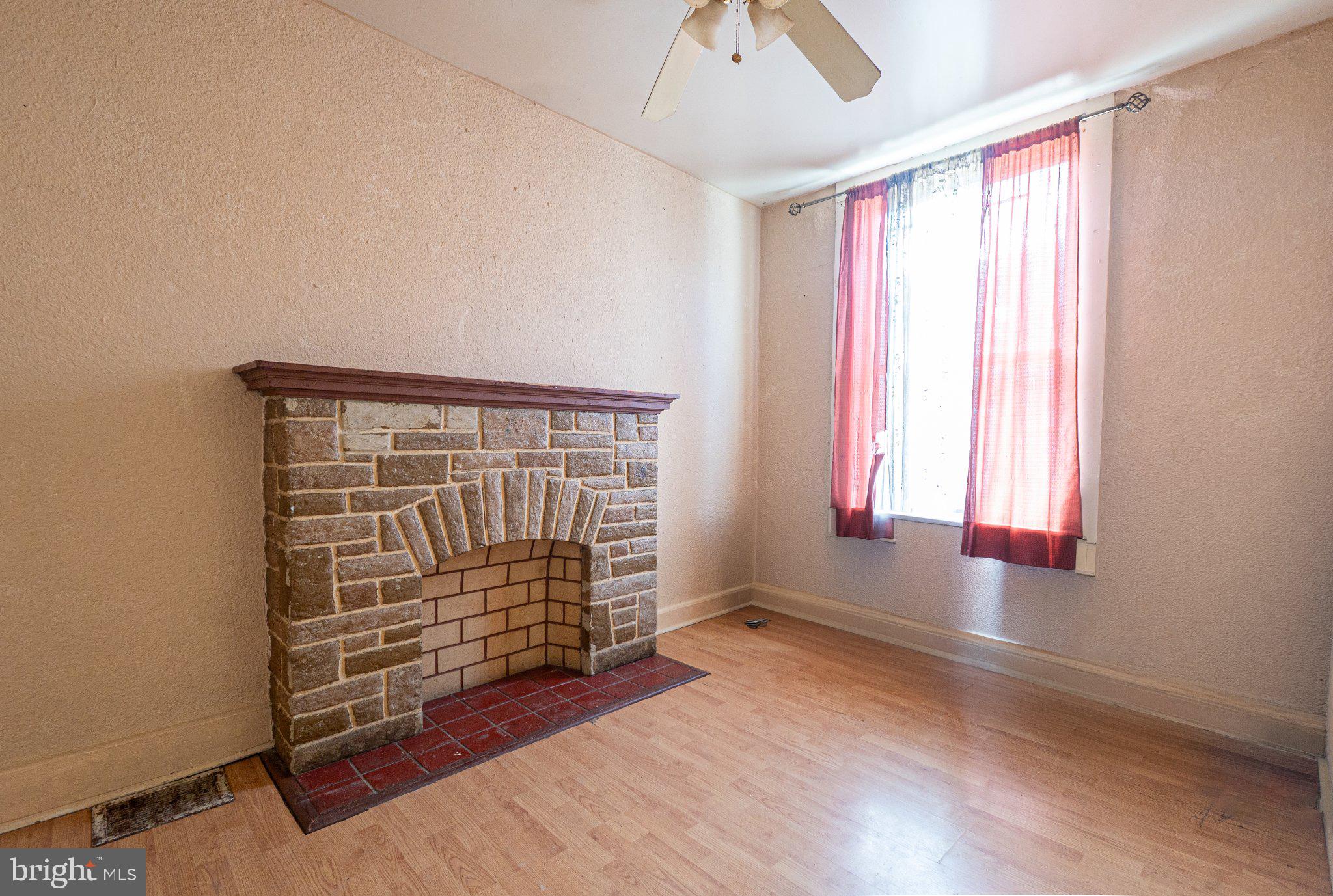 423 Furrow Street Baltimore, MD 21223 - Photo 5 of 24 an empty room with windows