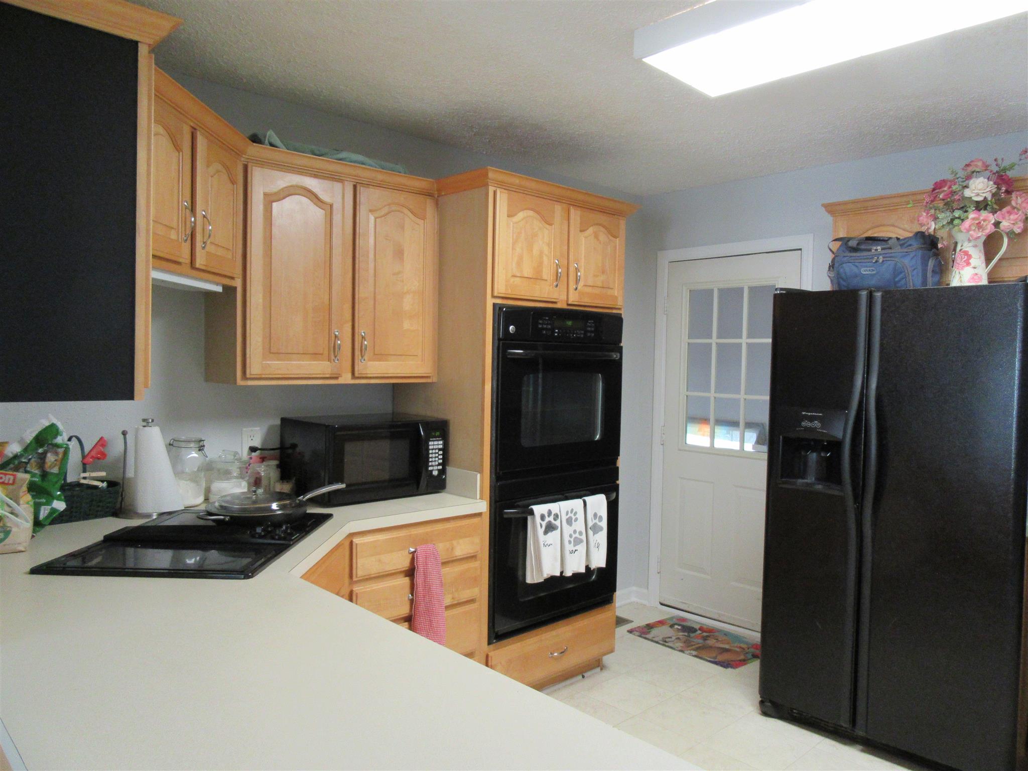 6739 East Benton Road Springfield, TN 37172 - Photo 6 of 29 a kitchen with stainless steel appliances granite countertop a refrigerator and a sink