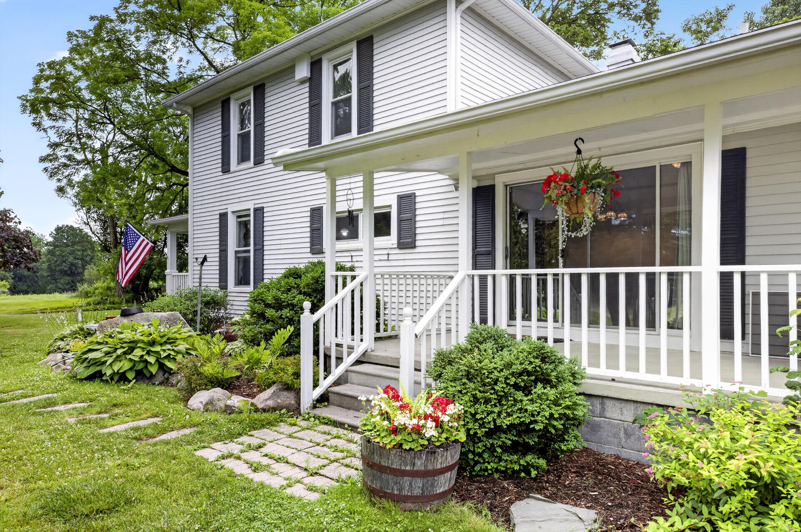 15610 Arnold Road Gregory, MI 48137 - Photo 12 of 90 Side porch with flowers