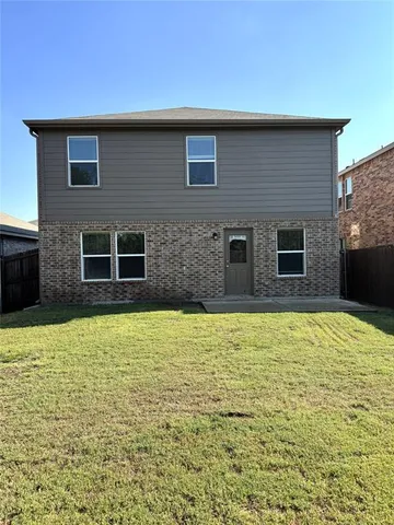 a house with swimming pool in front of it