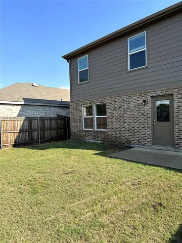 a brick house with a large window