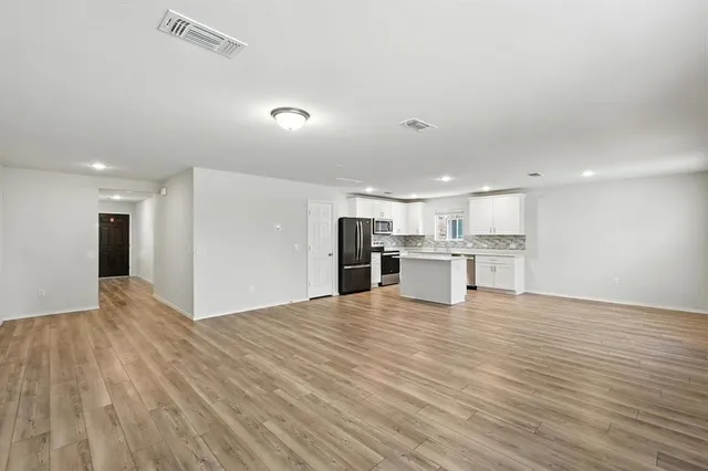 a view of kitchen with wooden floor