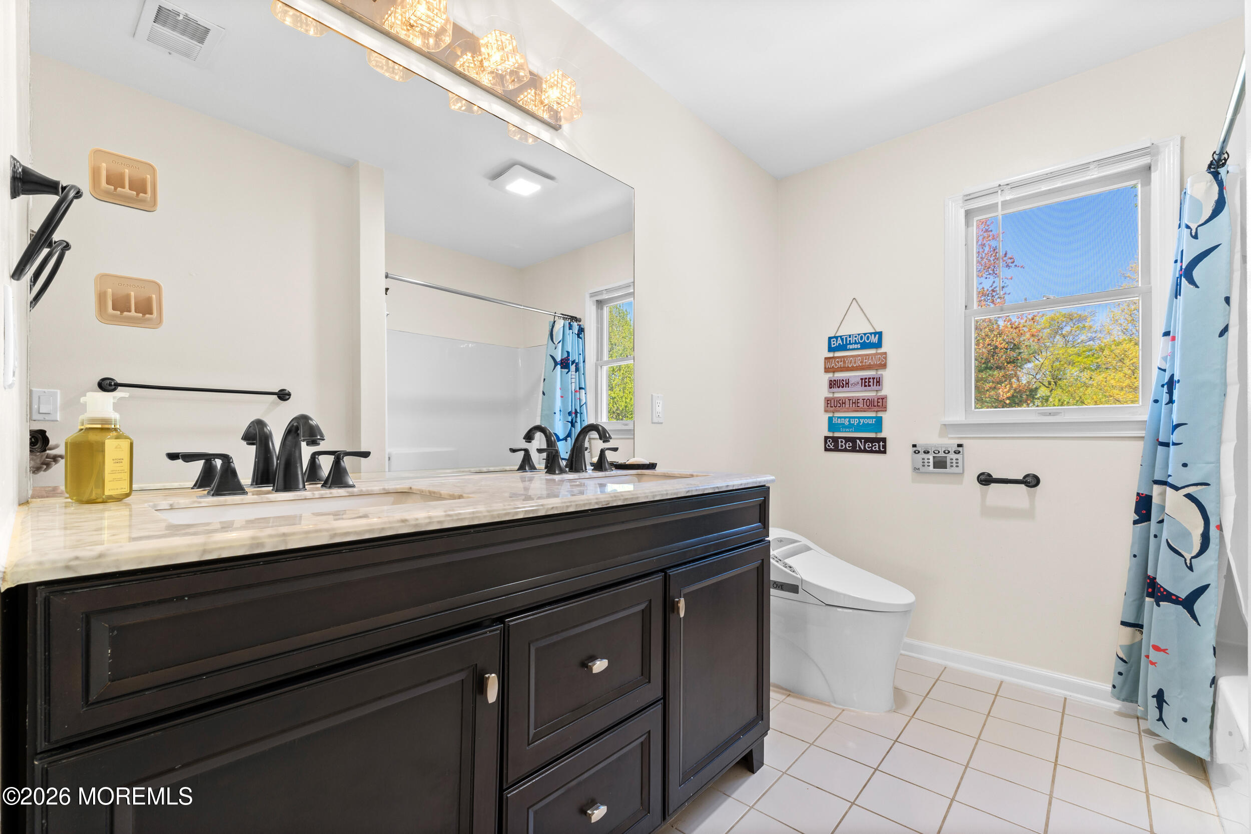 104 Autumn Road Matawan, NJ 07747 - Photo 39 of 64 a bathroom with a granite countertop sink a toilet and a mirror