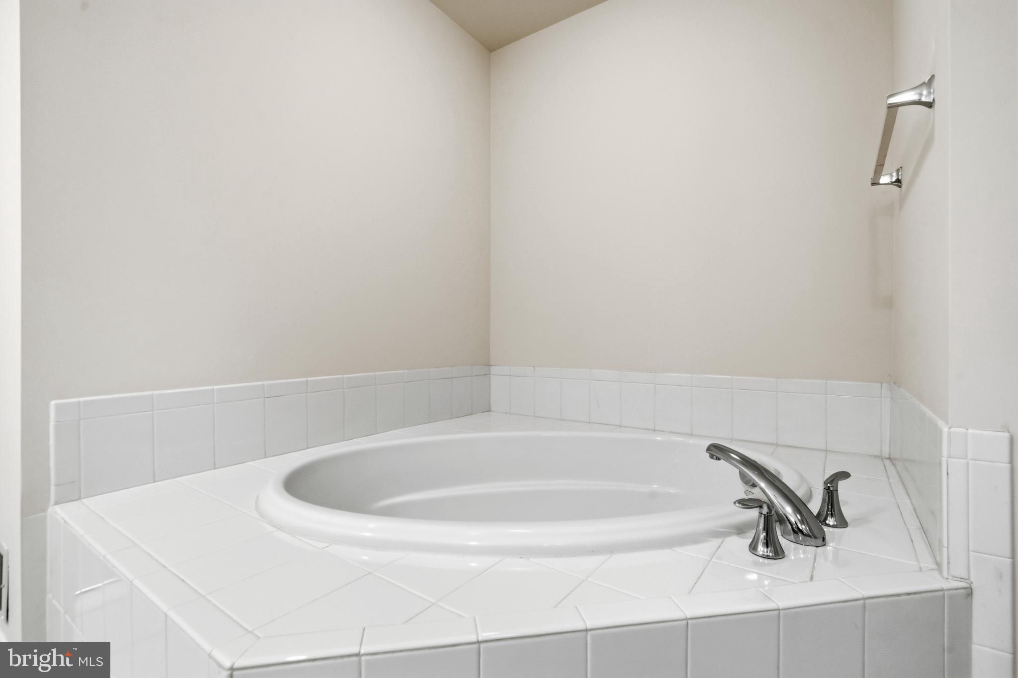 9227 Ribbon Falls Loop Bristow, VA 20136 - Photo 39 of 53 a close up of a bathtub