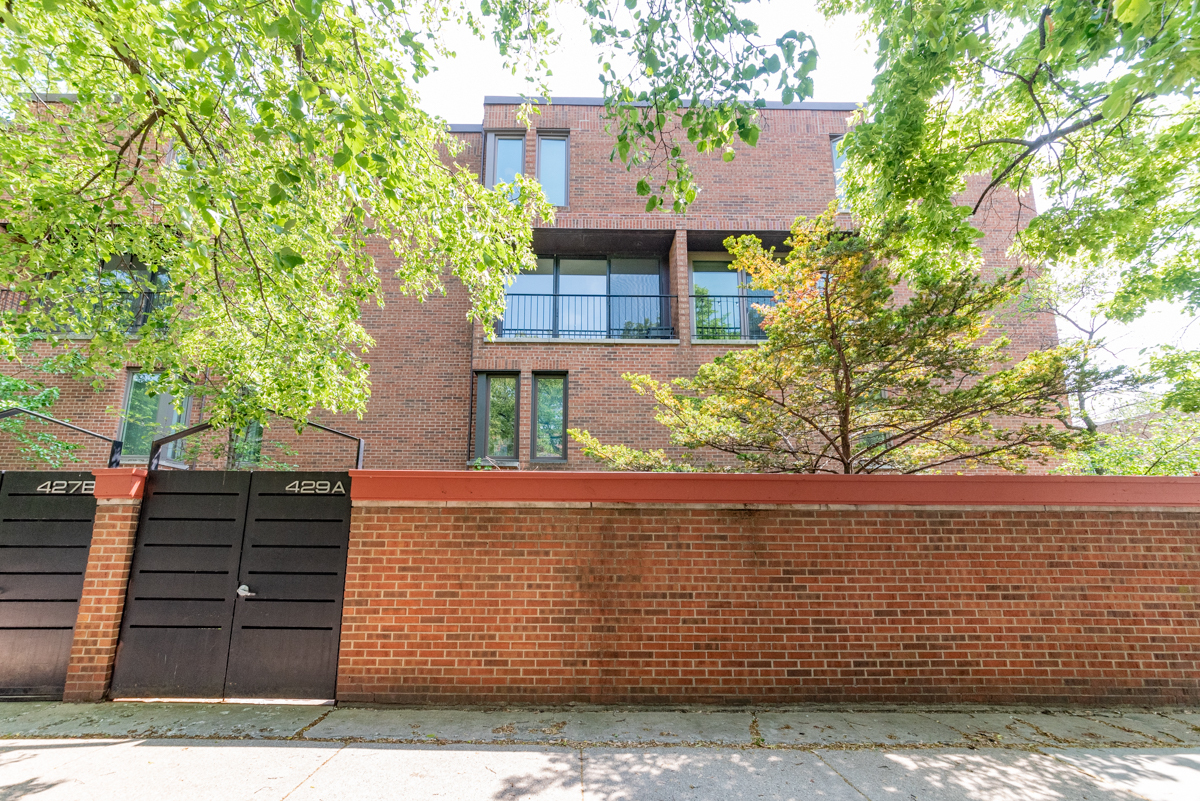 a view of a house with a tree