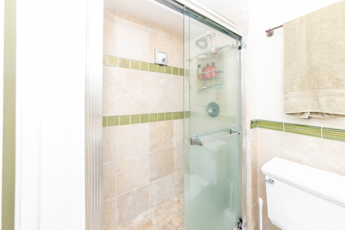 Undisclosed Address Chicago, IL 60614 - Photo 13 of 22 a bathroom with a shower and a toilet