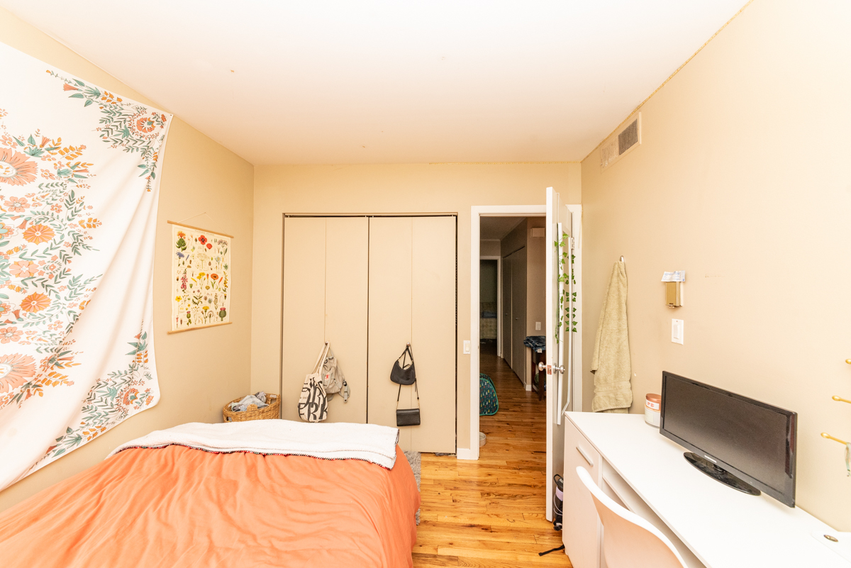 Undisclosed Address Chicago, IL 60614 - Photo 15 of 22 a spacious bedroom with a bed and a flat screen tv