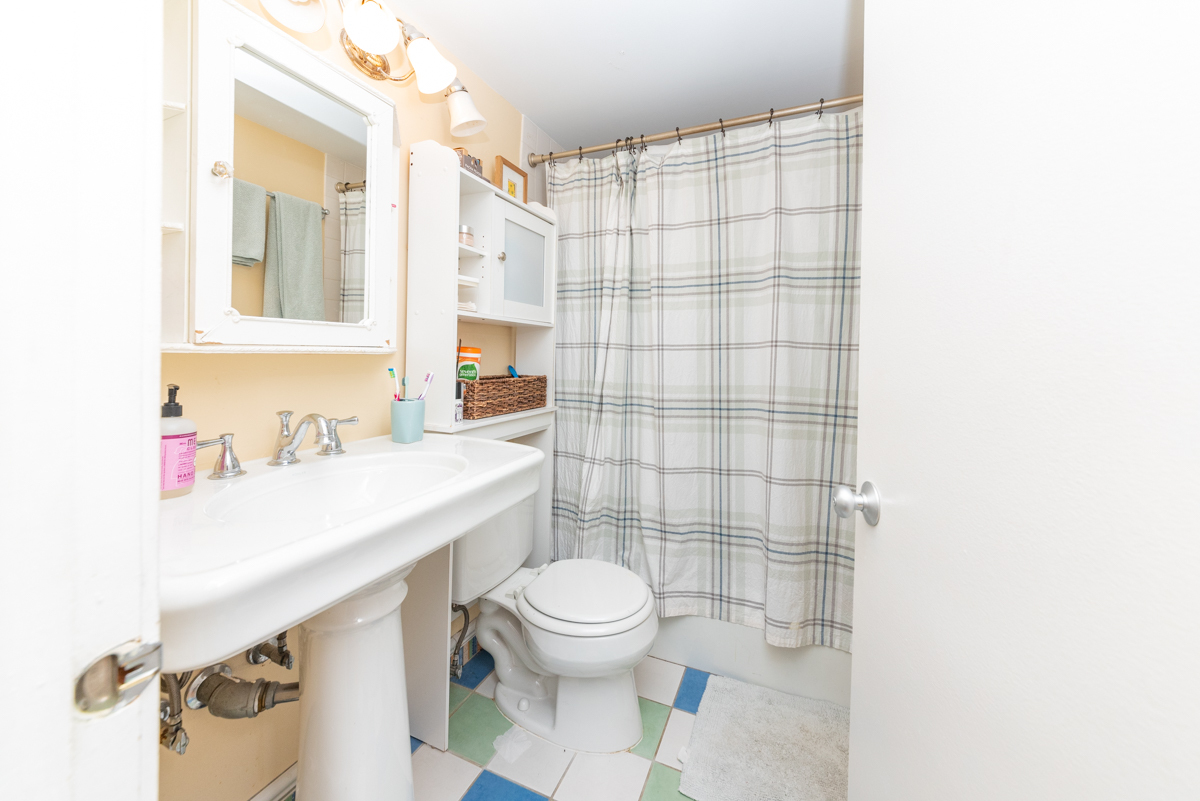 Undisclosed Address Chicago, IL 60614 - Photo 16 of 22 a bathroom with a sink a toilet and shower