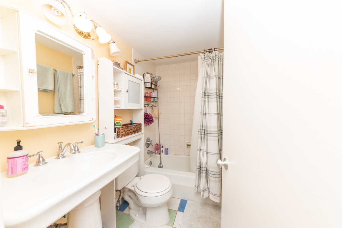 Undisclosed Address Chicago, IL 60614 - Photo 19 of 22 a bathroom with a sink toilet vanity and shower
