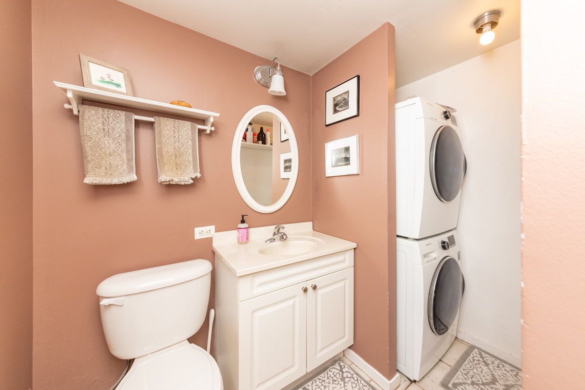 Undisclosed Address Chicago, IL 60614 - Photo 7 of 22 a bathroom with a toilet sink vanity mirror and tub