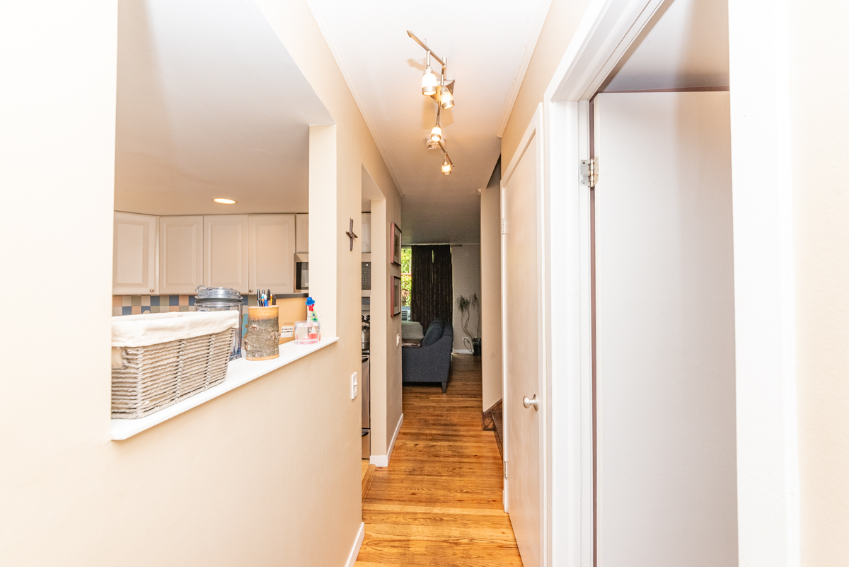 Undisclosed Address Chicago, IL 60614 - Photo 8 of 22 a view of a hallway view with wooden floor and staircase
