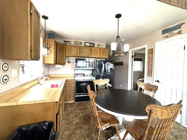 a dining room with furniture and window