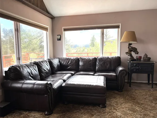 a living room with a couch and a large window