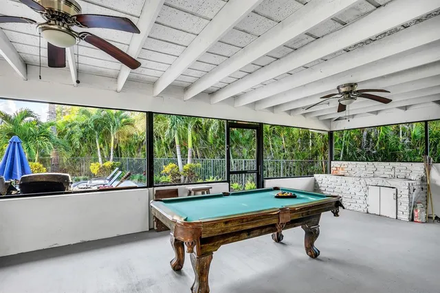 an aerial view of a house with yard and outdoor seating