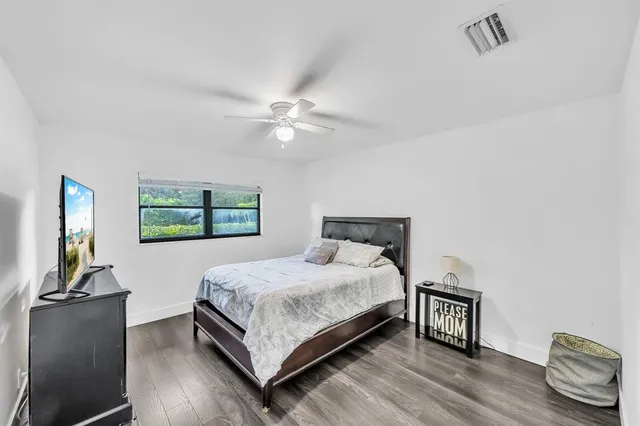 a bathroom with a sink vanity and mirror