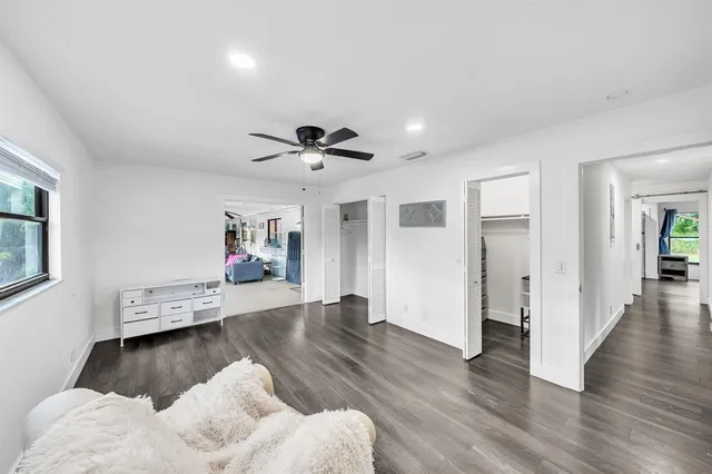 a view of a swimming pool with an outdoor seating and a garden