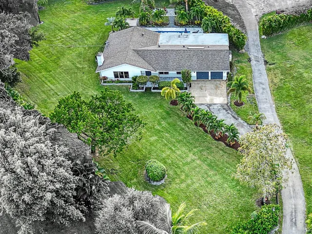 a kitchen with sink cabinets and wooden floor