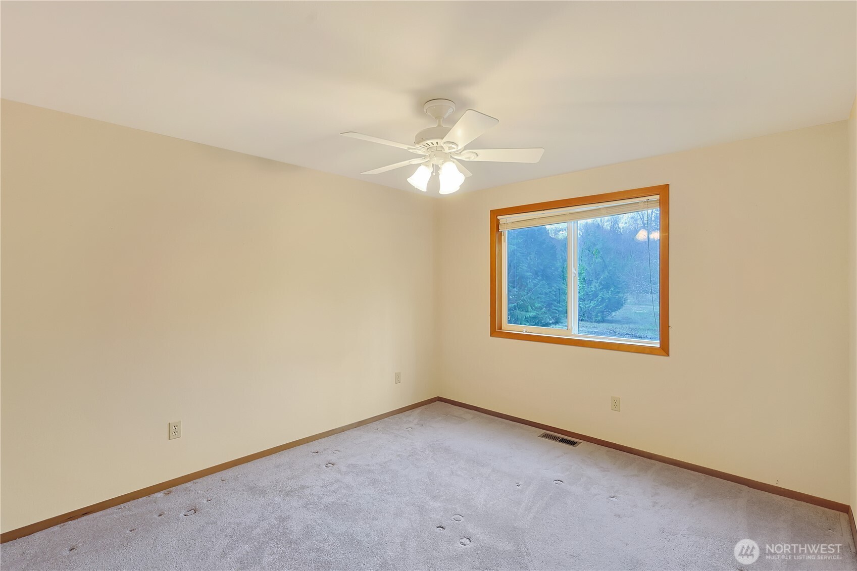 112 Whitewater Way Morton, WA 98356 - Photo 13 of 33 an empty room with a window and a ceiling fan