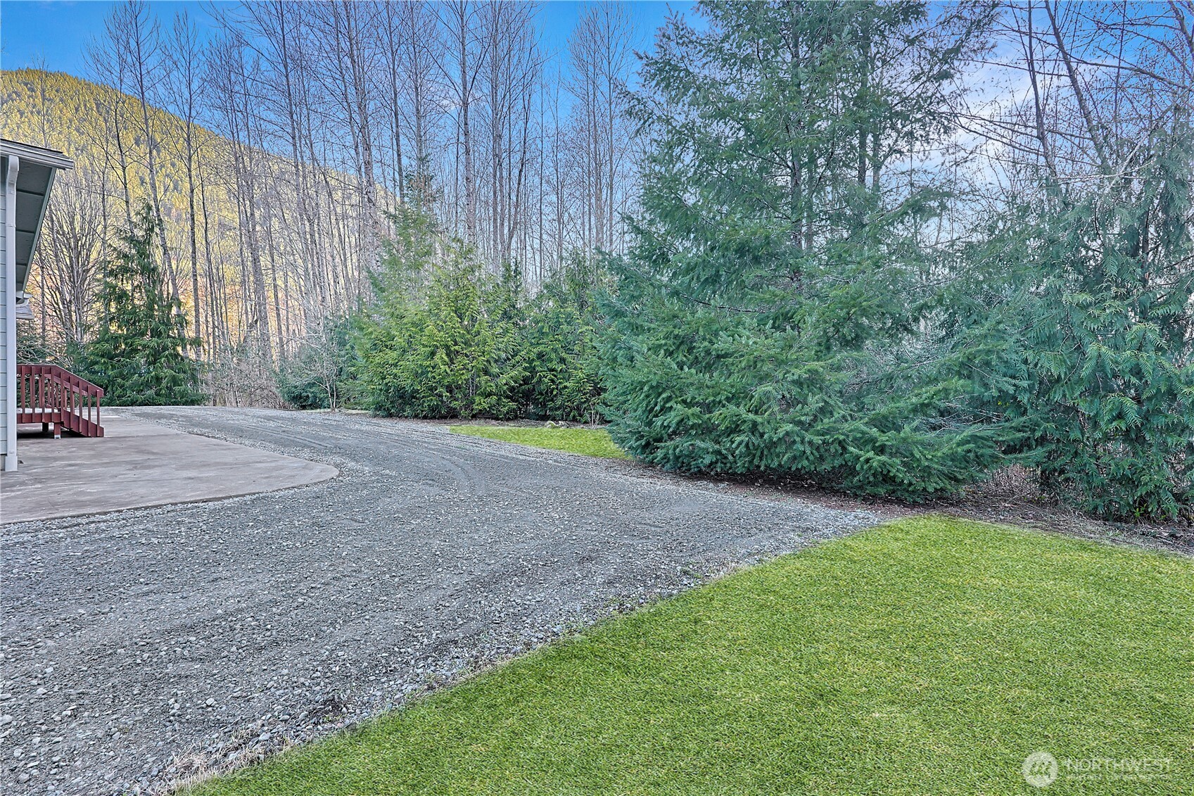 112 Whitewater Way Morton, WA 98356 - Photo 20 of 33 a view of a backyard with potted plants and large tree