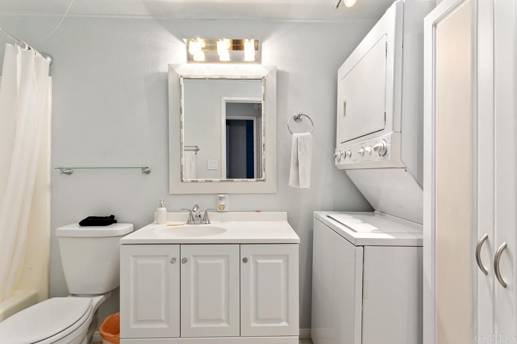 3606 Vista Rey Oceanside, CA 92057 - Photo 11 of 40 a bathroom with a toilet sink and mirror