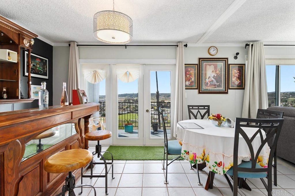 3606 Vista Rey Oceanside, CA 92057 - Photo 19 of 40 a view of a dining room with furniture and a chandelier
