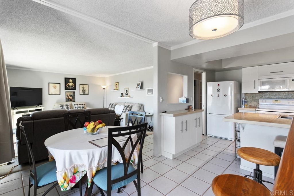 3606 Vista Rey Oceanside, CA 92057 - Photo 25 of 40 a living room with furniture a dining table and chairs