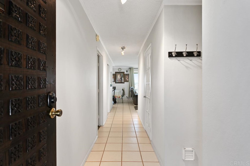 3606 Vista Rey Oceanside, CA 92057 - Photo 4 of 40 a view of a hallway with closet and a living room
