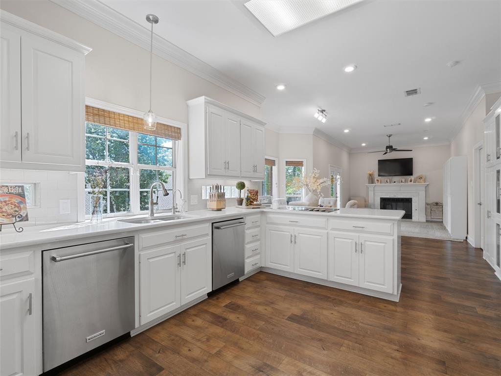 1103 Marigold Lane Longview, TX 75604 - Photo 9 of 34 a kitchen with white cabinets and white appliances