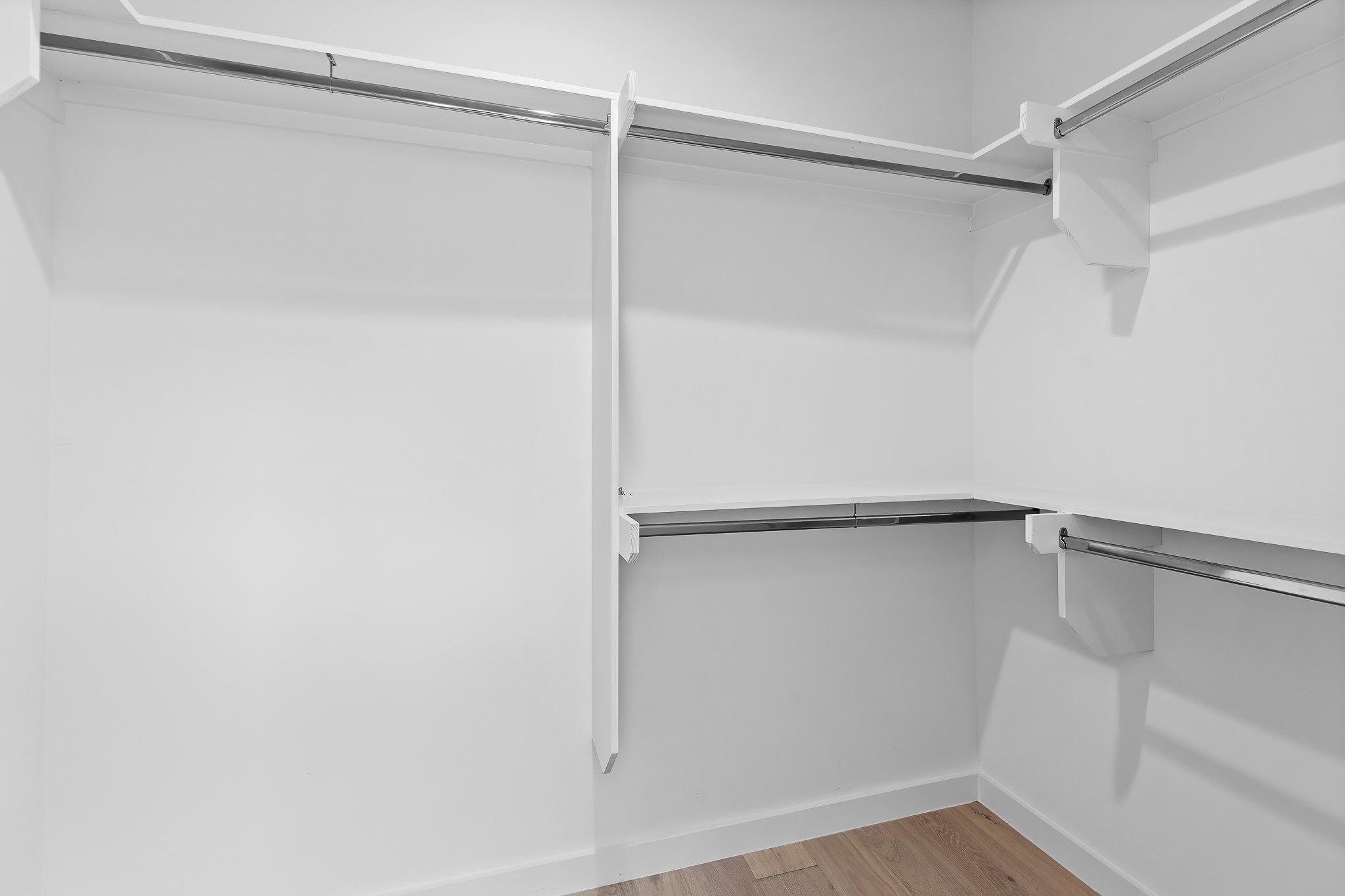5305 Ledesma Road, Unit 4 Austin, TX 78721 - Photo 31 of 40 Ample hanging space and shelving create an organized walk-in closet system.