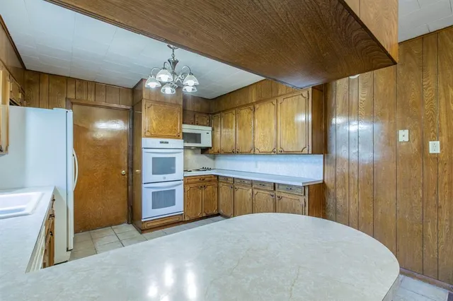 a bathroom with a sink a large mirror and a shower