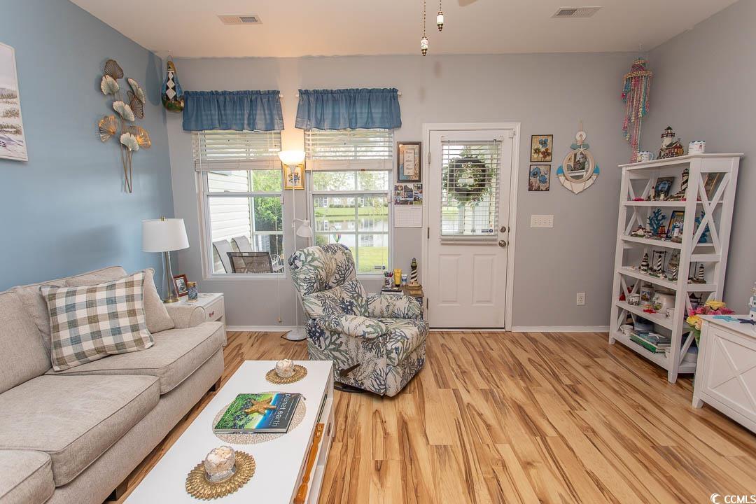 328 Kiskadee Loop, Unit E Conway, SC 29526 - Photo 2 of 37 Living area with light wood finished floors and baseboards
