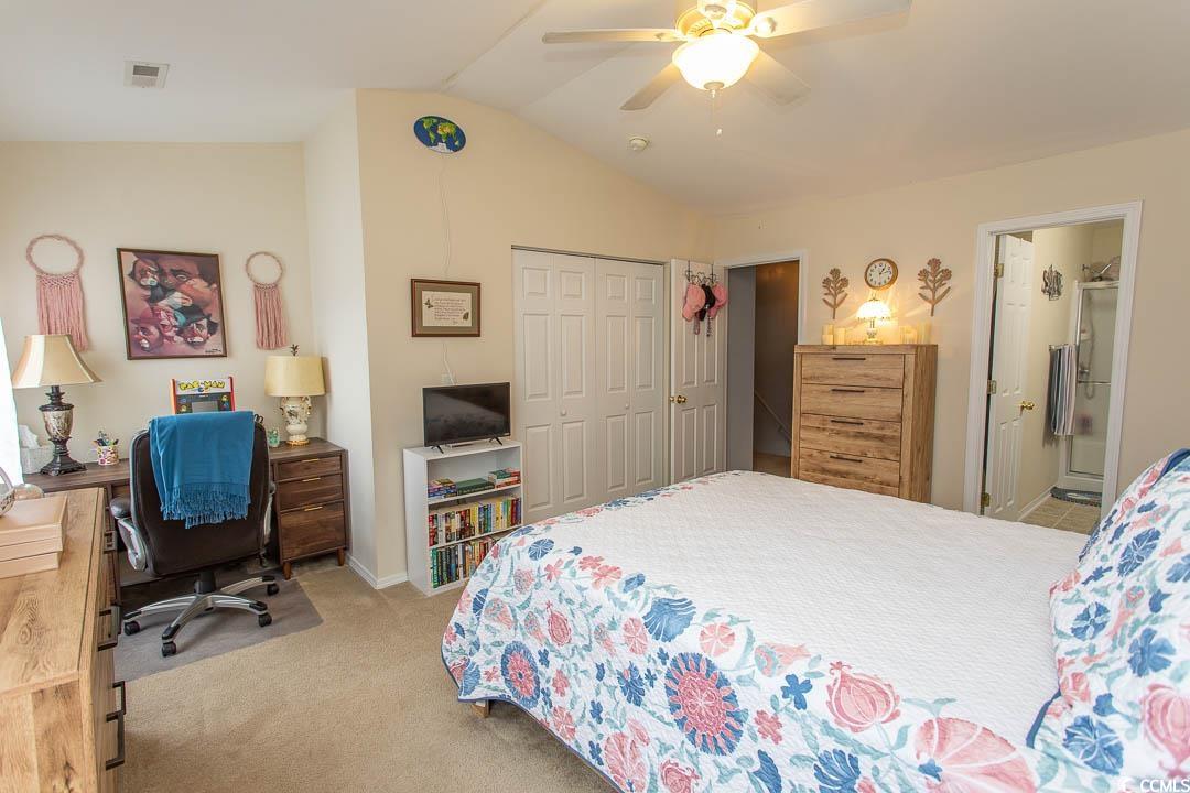 328 Kiskadee Loop, Unit E Conway, SC 29526 - Photo 23 of 37 Bedroom with vaulted ceiling, light carpet, a ceiling fan, a closet, and an office area