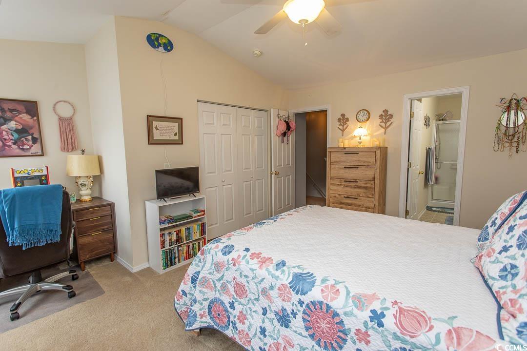 328 Kiskadee Loop, Unit E Conway, SC 29526 - Photo 24 of 37 Bedroom featuring light carpet, lofted ceiling, a ceiling fan, a closet, and ensuite bathroom