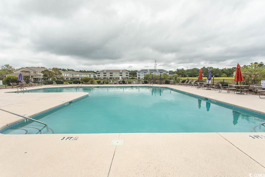 328 Kiskadee Loop, Unit E Conway, SC 29526 - Photo 35 of 37 Community pool featuring a patio