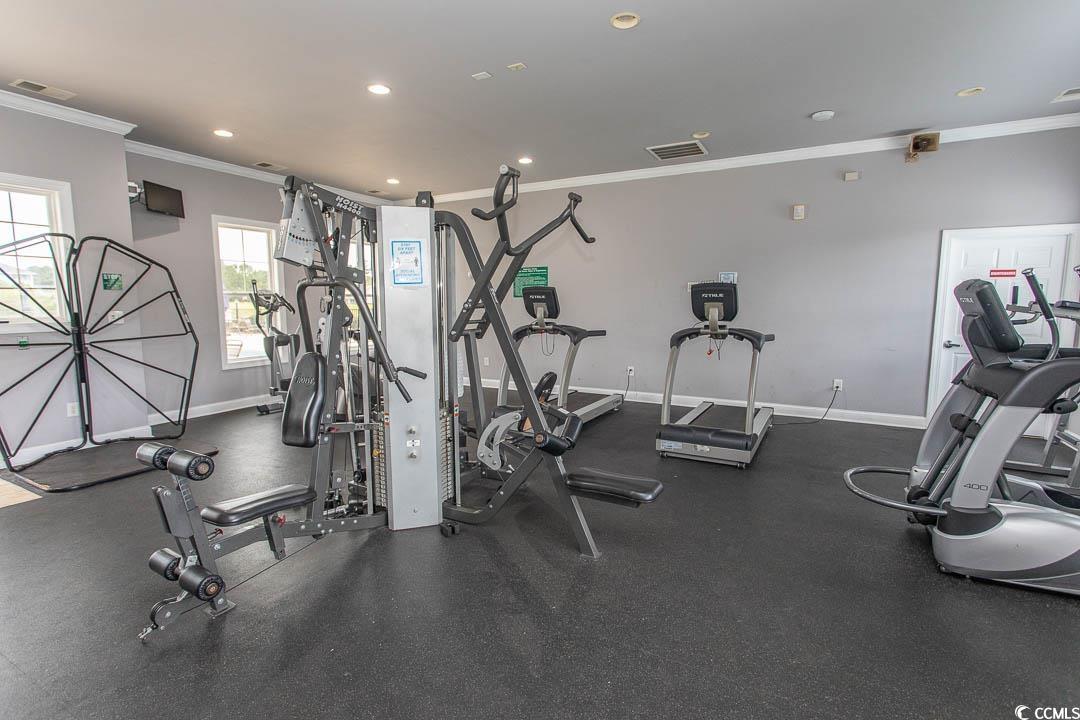 328 Kiskadee Loop, Unit E Conway, SC 29526 - Photo 36 of 37 Community pool featuring a patio area