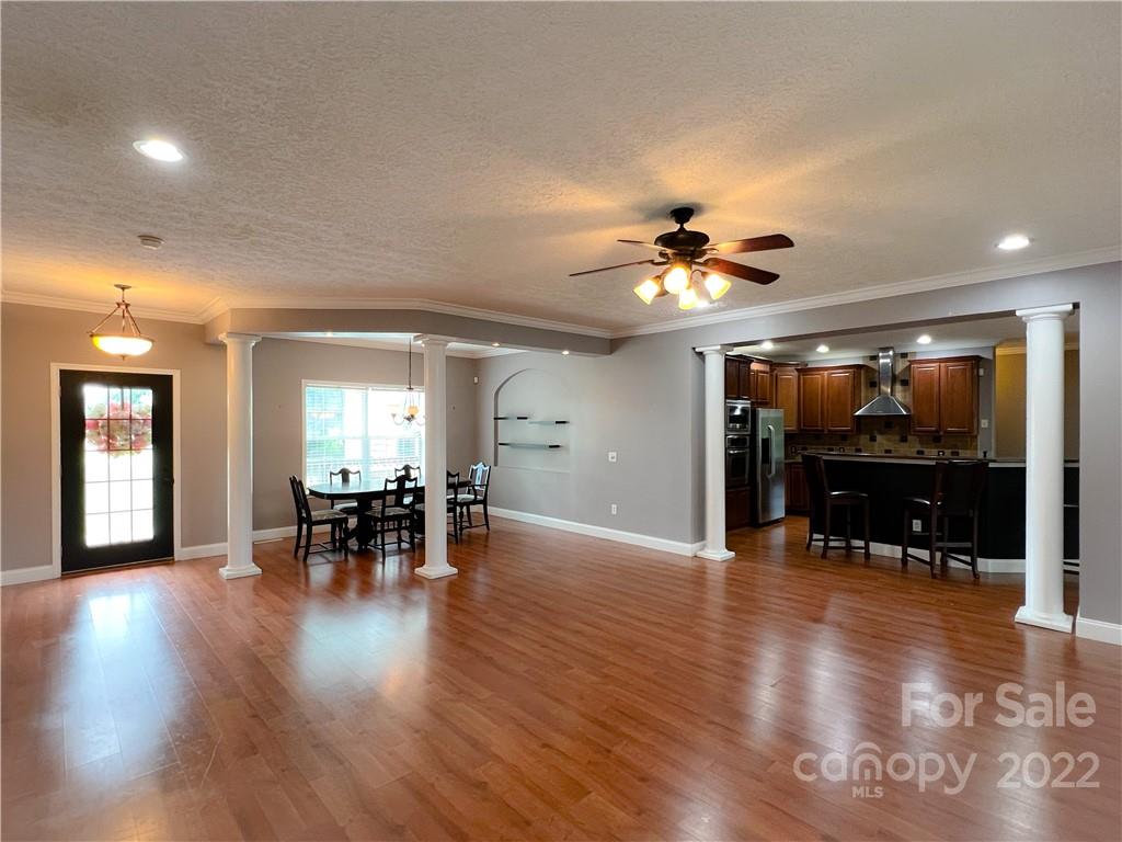 2223 Rodman Road Chester, SC 29706 - Photo 8 of 35 an open kitchen with furniture and a ceiling fan