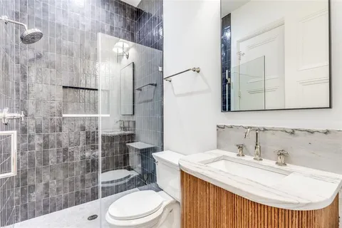 a balcony with furniture and a potted plant