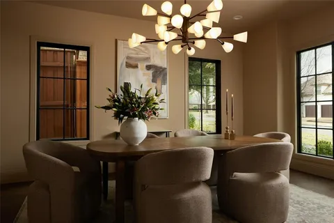 a living room with furniture fireplace and window