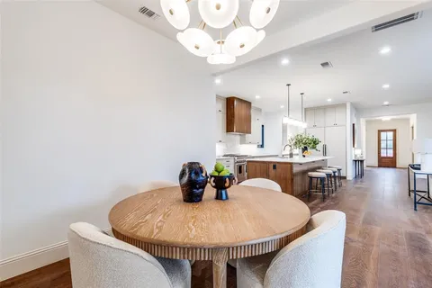 a bathroom with a double vanity sink toilet and shower