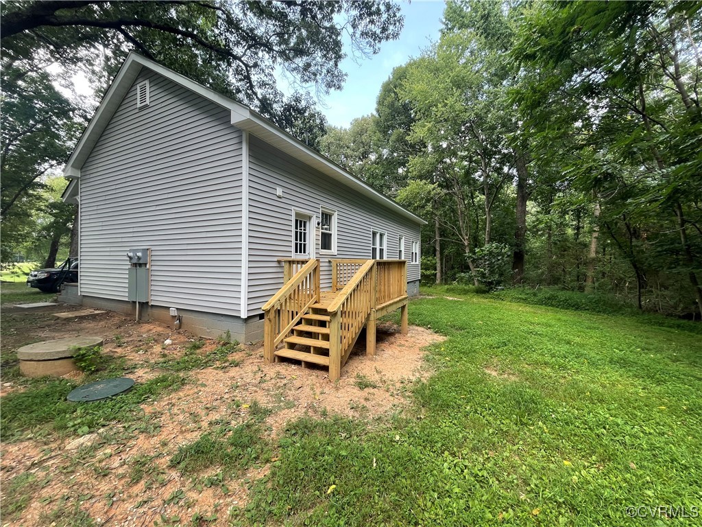 2809 Sandy Hook Road Goochland, VA 23063 - Photo 3 of 18 a view of backyard with a garden and deck