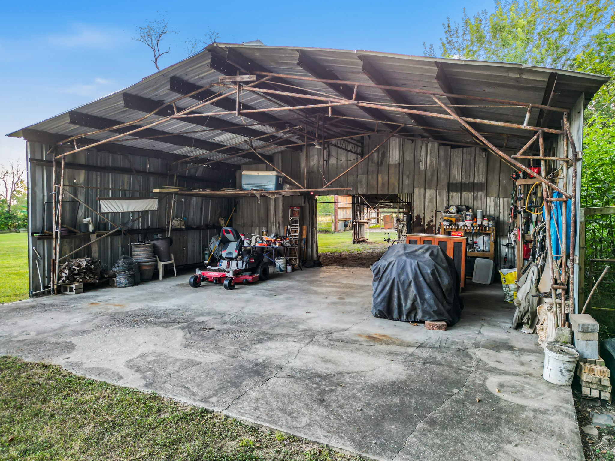 9731 Hadden Road Baytown, TX 77521 - Photo 43 of 47 a view of a garage with parked cars