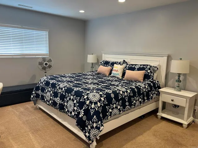 a white toilet sitting next to a shower curtain